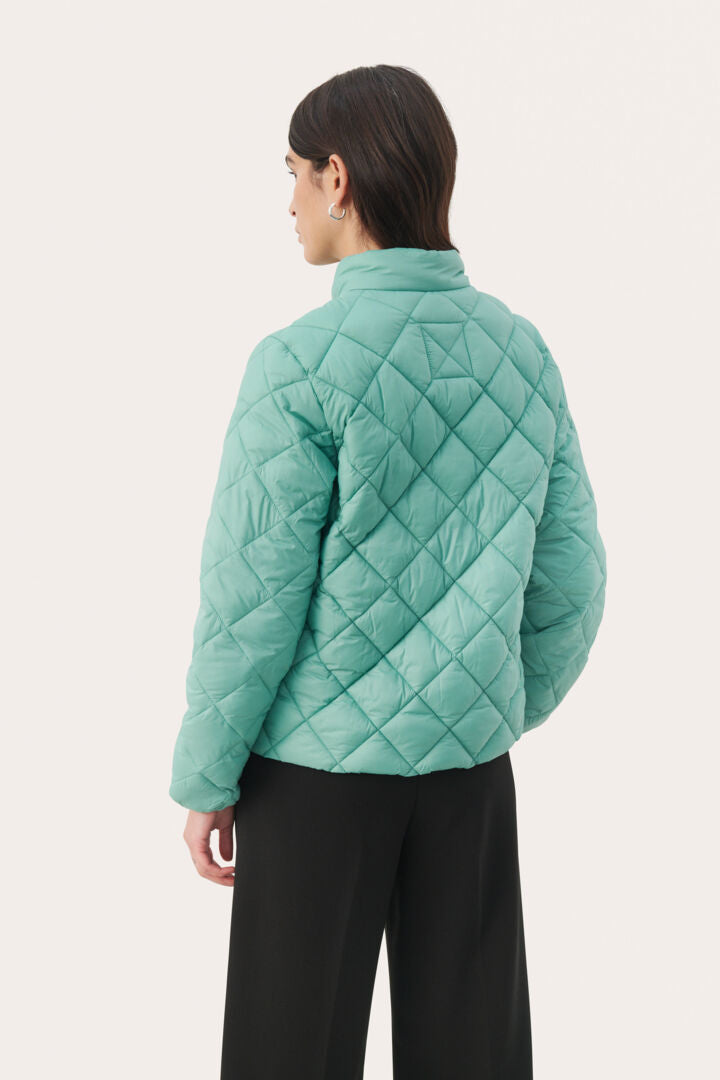 Manteau matelassé coloré à motifs géométriques