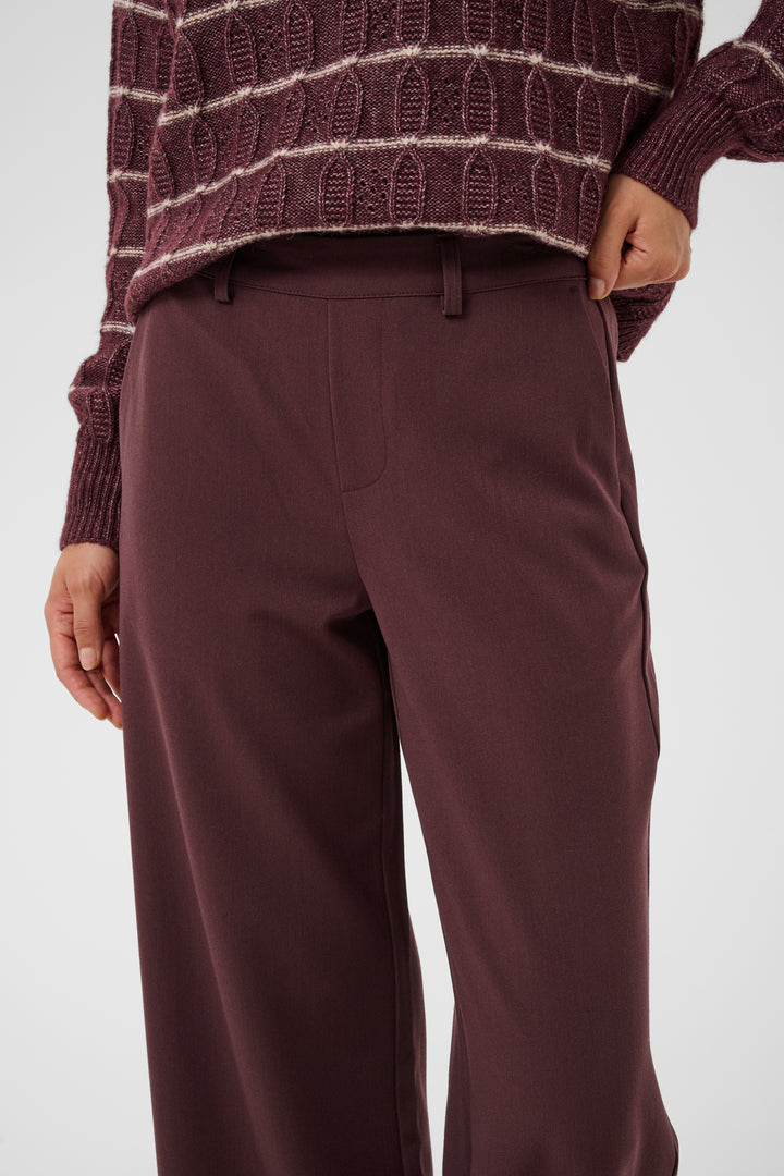 Pantalon Valley pants - Le pantalon long ajusté à taille haute en tissu extensible fluide