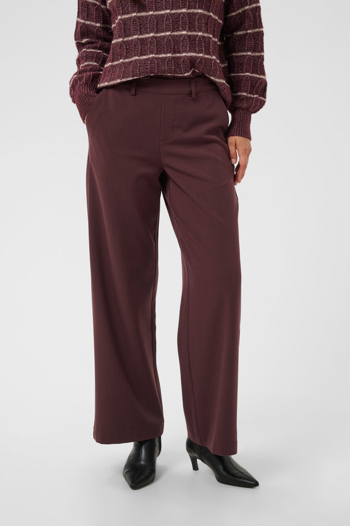 Pantalon Valley pants - Le pantalon long ajusté à taille haute en tissu extensible fluide