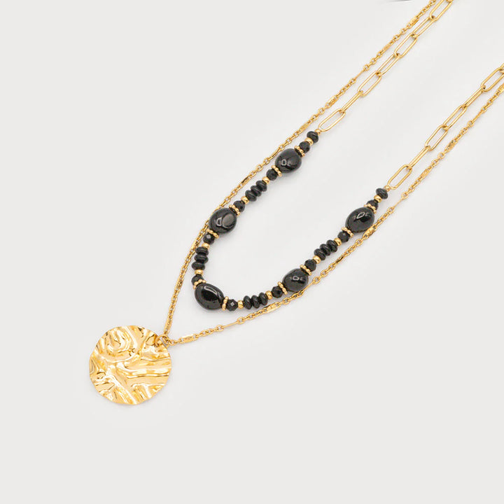 Collier double rang perles et médaillon martelé