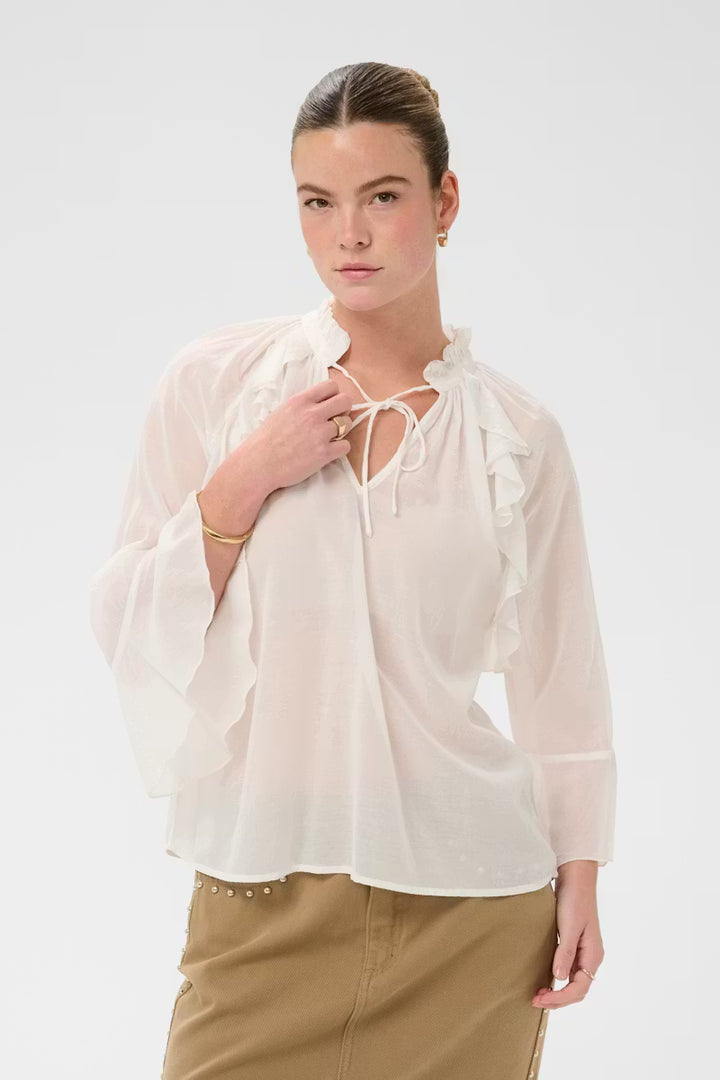 Blouse à volants Flora – Coupe évasée et col montant ajustable