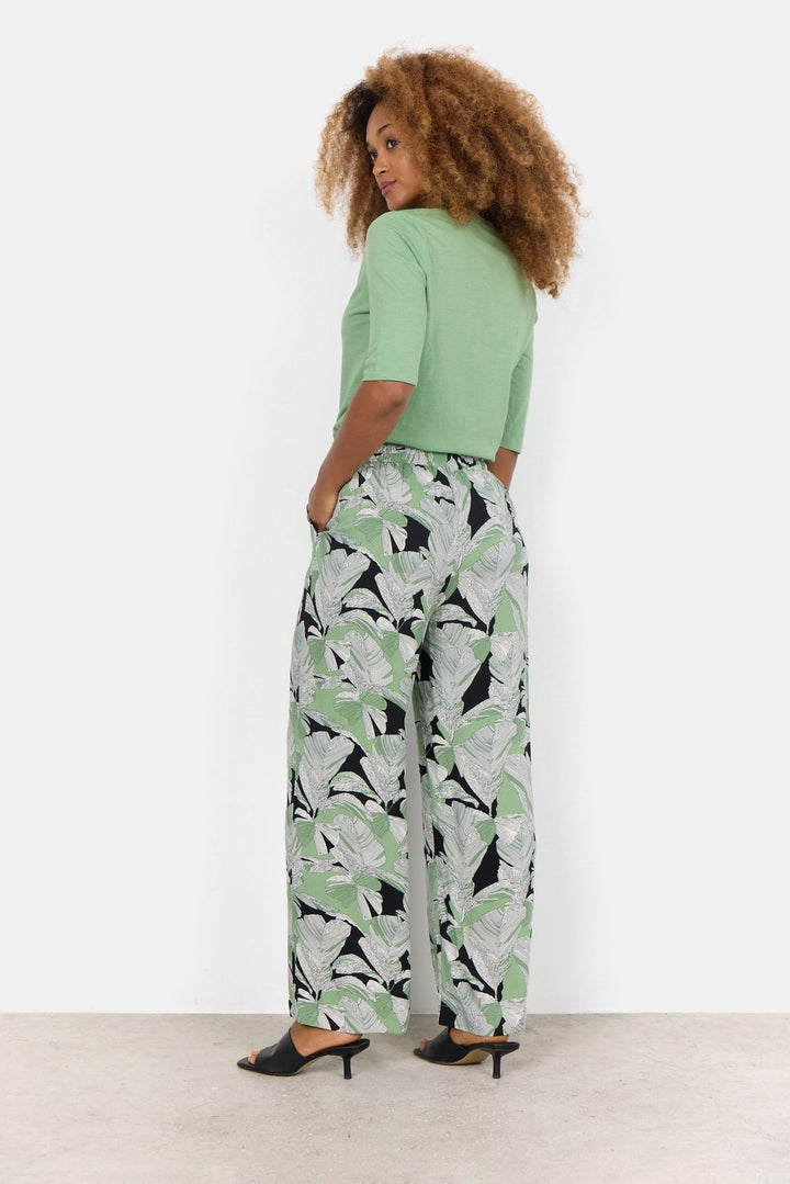 Pantalon en toile avec imprimé de feuilles de palmier