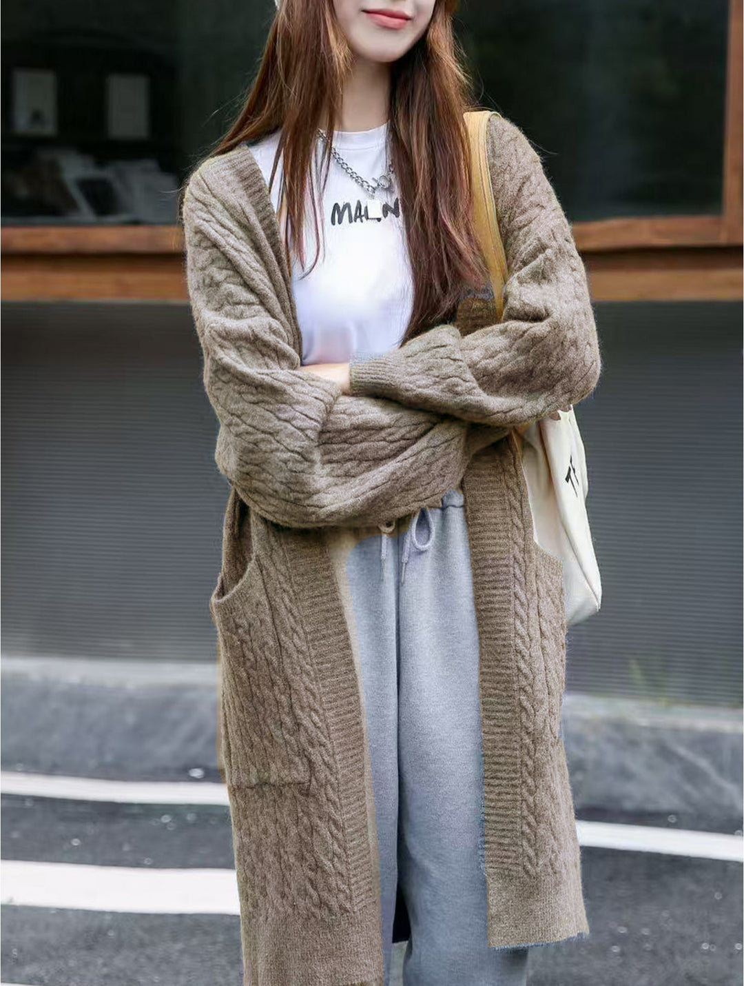 Cardigan en tricot long avec poches