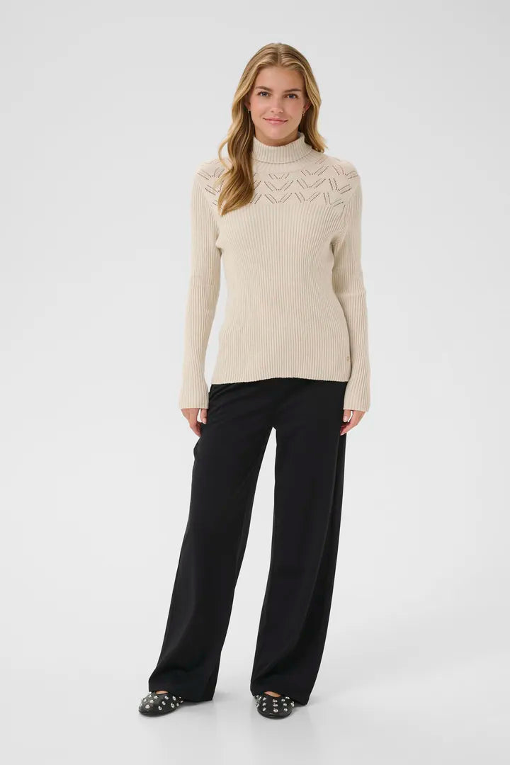 Col roulé avec détails au niveau du buste Dela