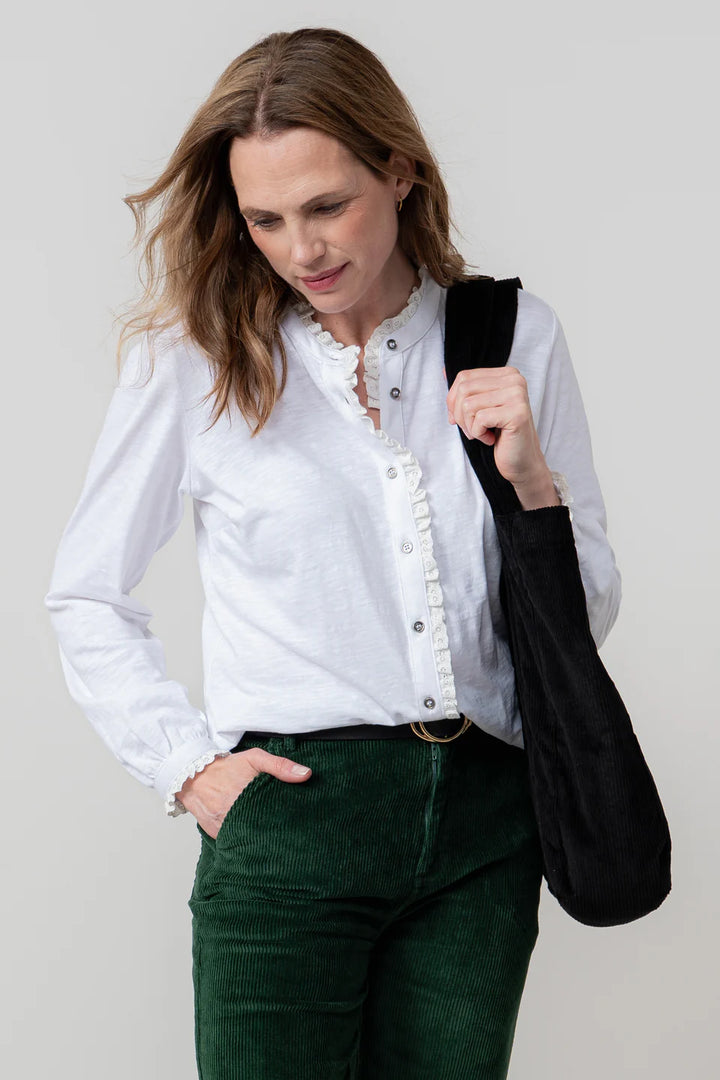 Blouse en coton bio à col volanté et broderie