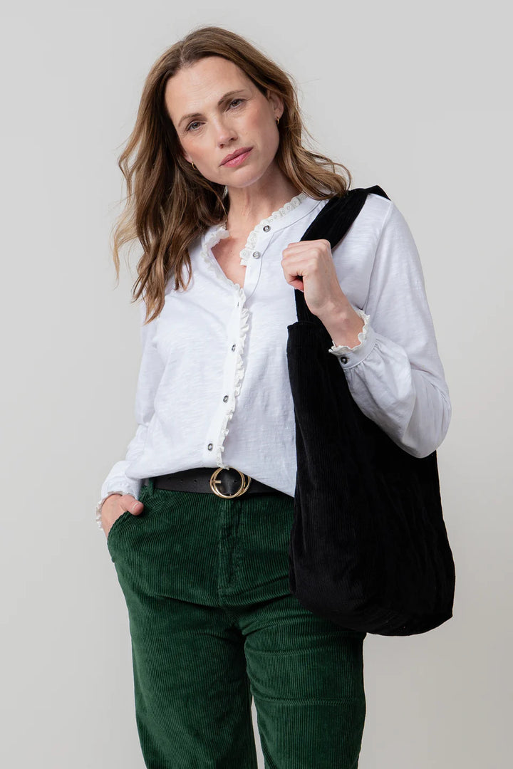 Blouse en coton bio à col volanté et broderie