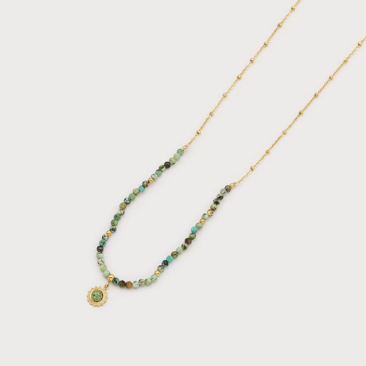 Collier à petites perles naturelles - Médaillon soleil