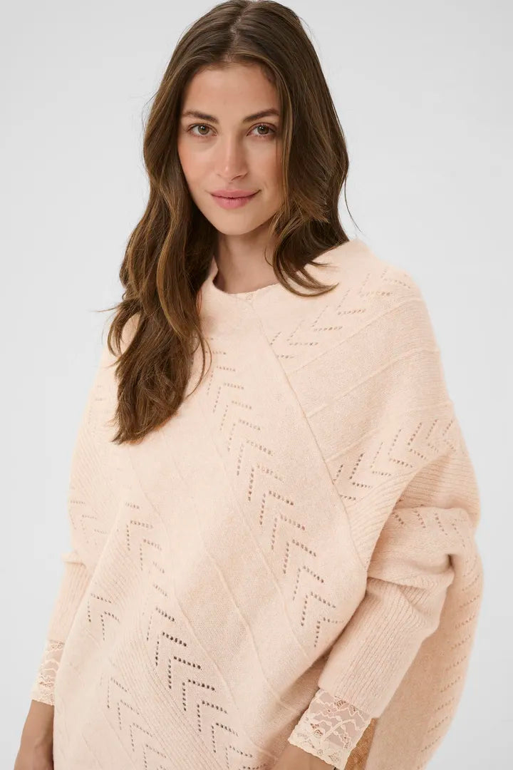 Un poncho à la coupe flatteuse, avec base en V et manches longues Holiday